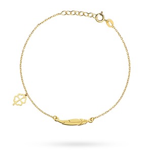 Gold bracelet with a feather and a clover