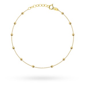 Bracelet with smooth gold balls on the leg