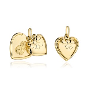 Gold medallion of Our Lady of Częstochowa in a heart with a bow