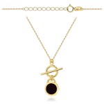 Gold circle necklace with a black stone