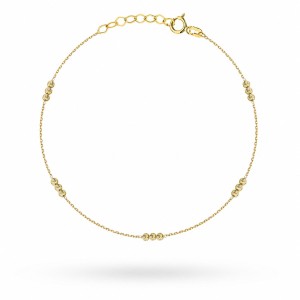 Gold bracelet with triple diamond balls on the leg