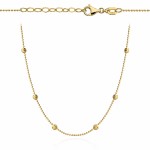 Gold ball necklace and six diamond-cut balls